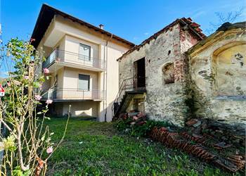 Semi-detached house with garage and garden.